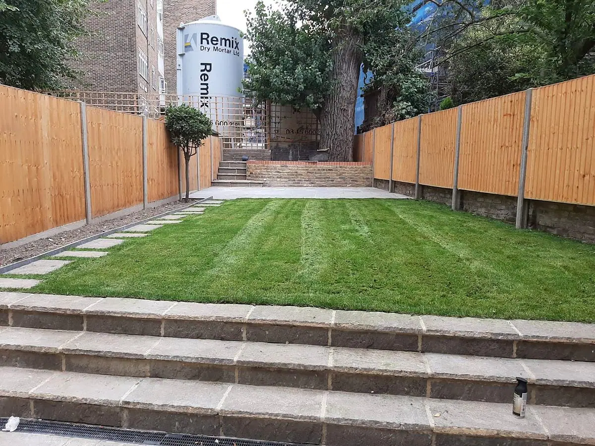 The finished landscaped garden with steps and paving