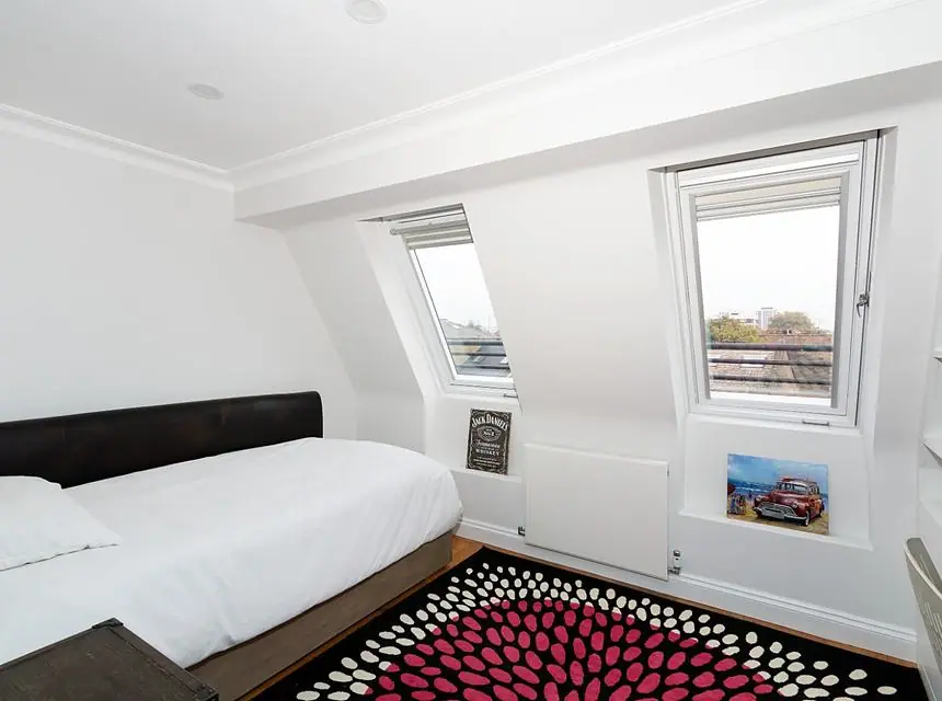 A finished bedroom under the new roof