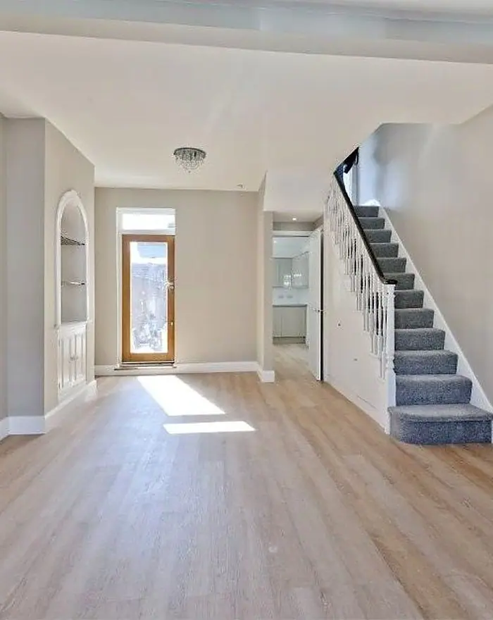 A refurbished hallway and staircase by Ogival